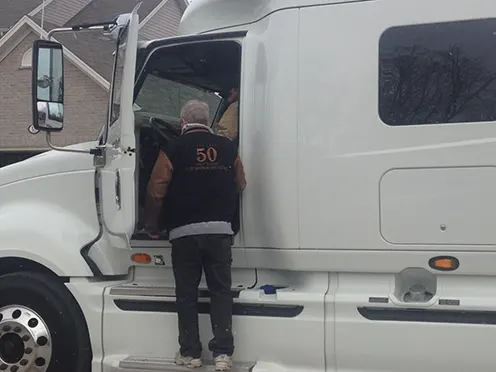 A-Zip owner Terry standing in front of a white truck